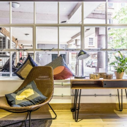 Comfortable lounge area with designer chairs near large windows, 2 Bath Place, Shoreditch, London