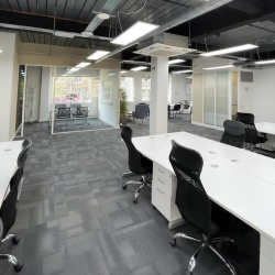 Bright open-plan office space featuring rows of white desks, 2 Bath Place, Shoreditch, London