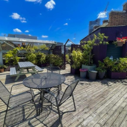 Sunny rooftop deck with outdoor seating and lush plants, 2 Bath Place, Shoreditch, London