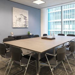 Modern boardroom featuring a long meeting table and blue feature wall, One Kingdom Street, London, W2.