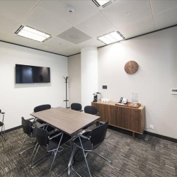 Small private meeting room with wall-mounted screen and storage, One Kingdom Street, London, W2.