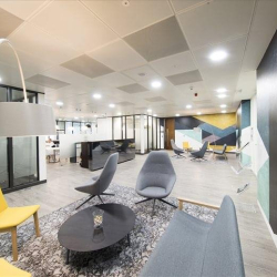 Bright, wide-angle lobby with stylish lounge chairs and designer lighting, One Kingdom Street, London, W2.