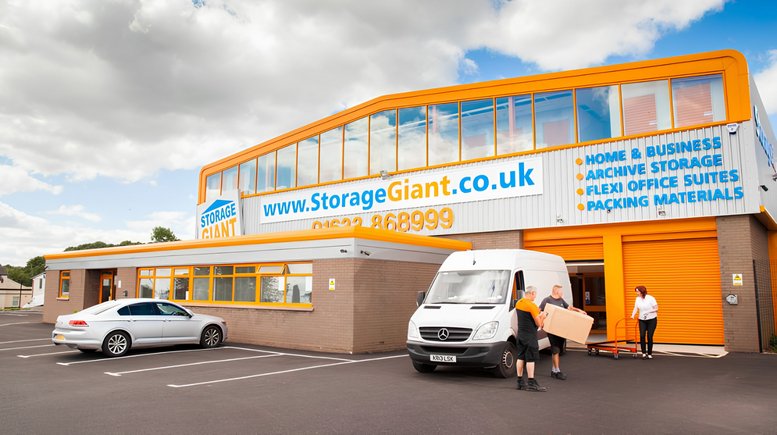 Exterior view of the Storage Giant building at Unit 12 Ty-Coch Way with a loading van.