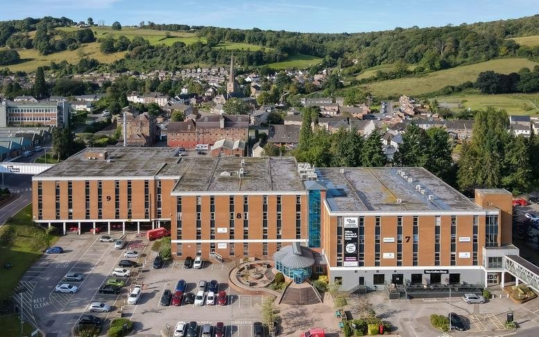 Aerial exterior view of the multi-story brick facade at Vantage Point in Mitcheldean.