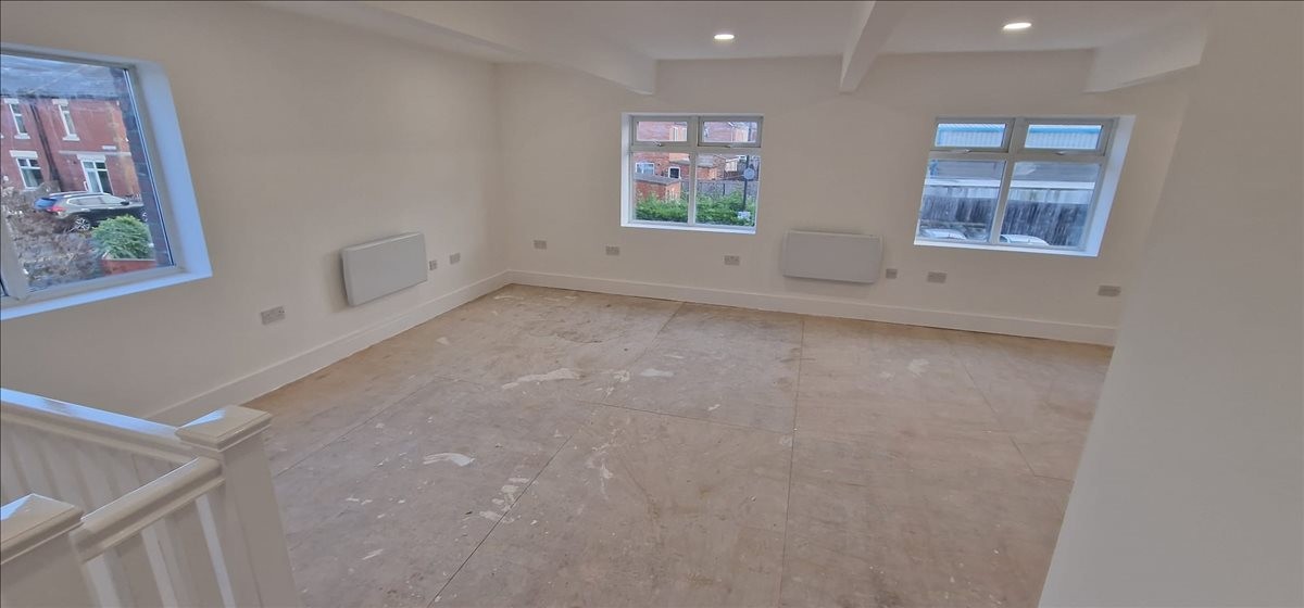 Spacious open-plan office at 11 West View with neutral walls and multiple windows for natural light.