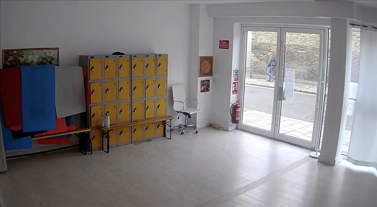 Spacious entrance area at 4 Browning Street featuring yellow lockers and a large glass door.