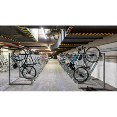 Secure indoor bicycle storage room with multi-level metal racks.. Click for details.
